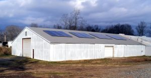Brewery solar energy system on barn metal roof standing seam